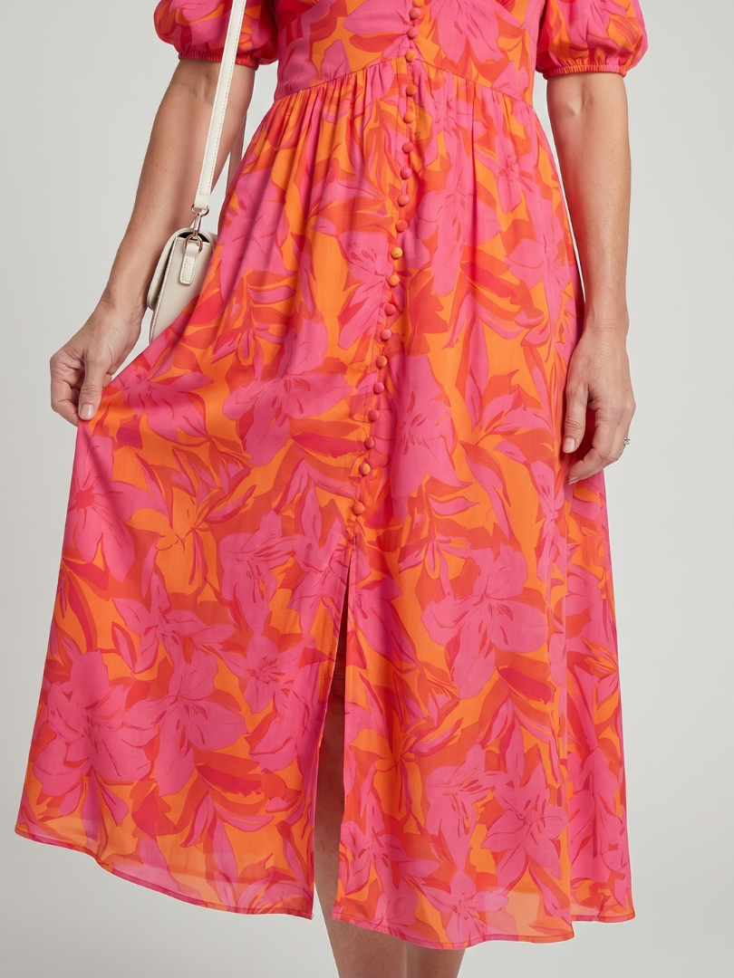 Zarelle | Vestido midi con escote en V y mangas abullonadas, en un estampado floral audaz