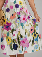 Flor | Vestido midi con estampado floral, sin mangas y cuello redondo